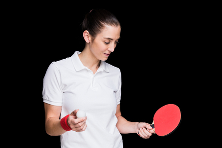 Female athlete playing  table tennis  on black backgroundの写真素材