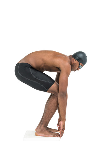 Swimmer ready to dive on white backgroundの写真素材