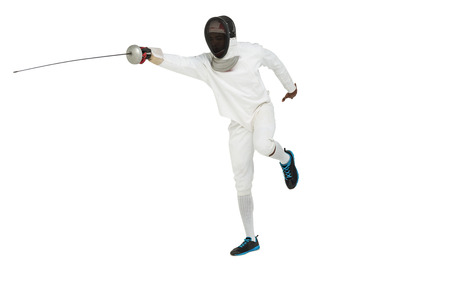 Man wearing fencing suit practicing with sword on white background