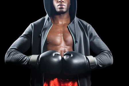Mid section of muscular boxer on black backgroundの写真素材