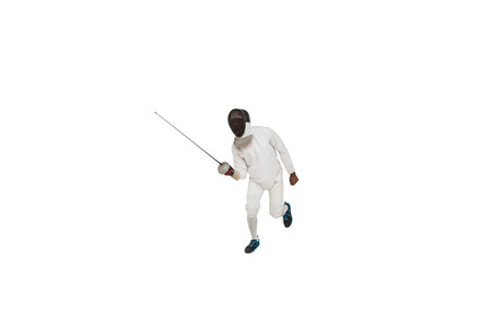 Man wearing fencing suit practicing with sword on white background