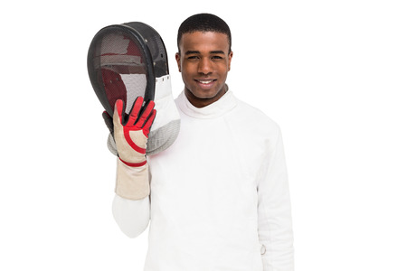 Portrait of swordsman holding fencing mask on white backgroundの写真素材