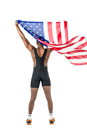 Athlete posing with american flag after victory on white backgroundの写真素材