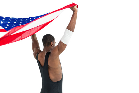 Rear view of athlete holding american flag on white backgroundの写真素材