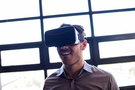 Businessman using virtual reality device in the office