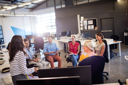 Casual colleagues having a meeting in the officeの写真素材