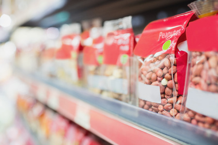 View of shelves with nuts in the supermarketの写真素材