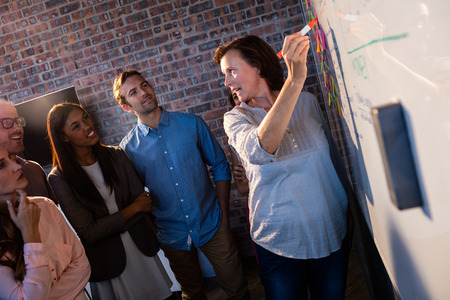 Manager running a briefing in the office