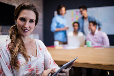 Portrait of a casual businesswoman in the officeの写真素材