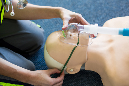 Female paramedic during cardiopulmonary resuscitation training in hospital