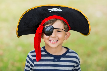 Portrait of boy pretending to be a pirate in the parkの写真素材