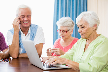 Seniors spending time together in a retirement homeの写真素材