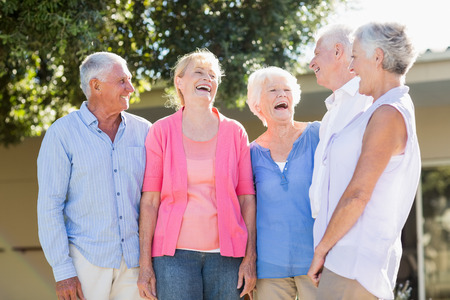 Seniors standing together outside the retirement homeの写真素材