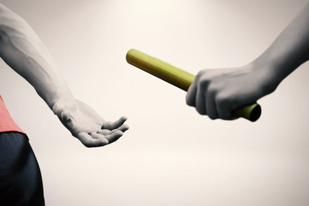 Sportswoman running on a white background against grey backgroundの写真素材