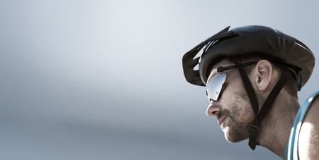 Man wearing a helmet against grey vignetteの写真素材