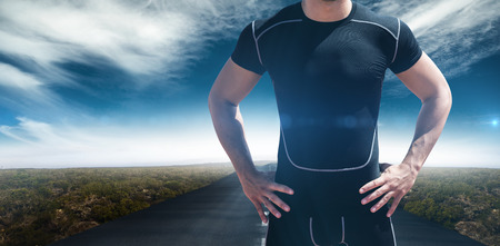 Portrait of athletic man chest against view of an empty streetの写真素材