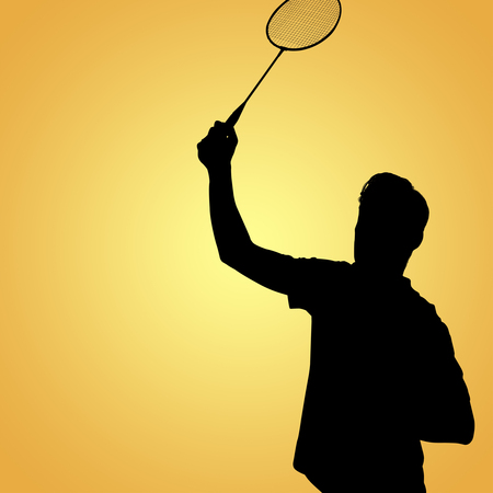 Badminton player playing badminton  against yellow vignetteの写真素材