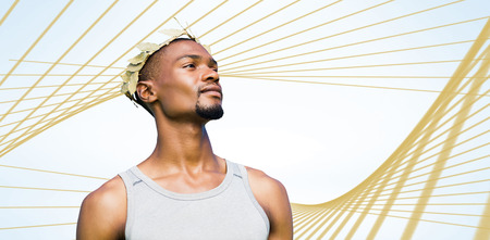 Portrait of victorious sportsman  against blue angular designの写真素材