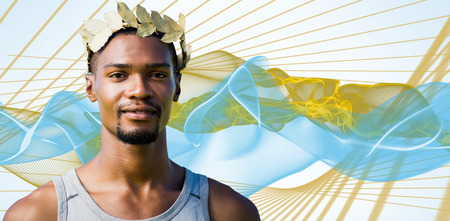 Portrait of victorious sportsman with crown of laurels  against blue waveの写真素材