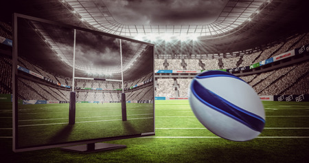Rugby ball against rugby stadiumの写真素材