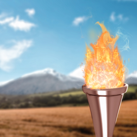 Fire against country scene with mountainの写真素材