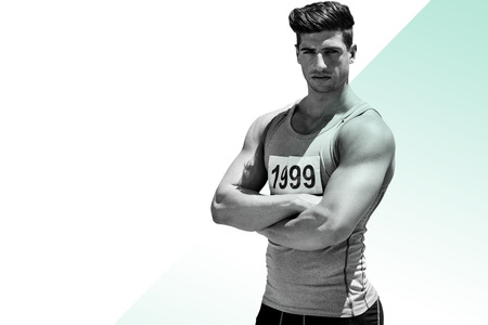 Portrait of handsome sportsman is posing with crossed arms against different colorsの写真素材