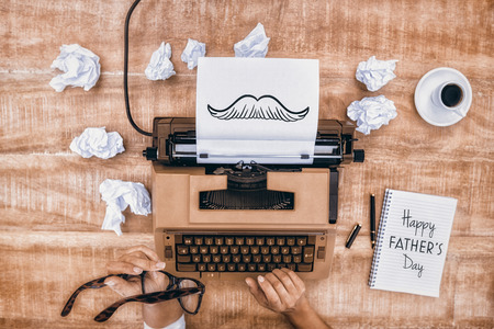 Hands using typewriter for fathers day
