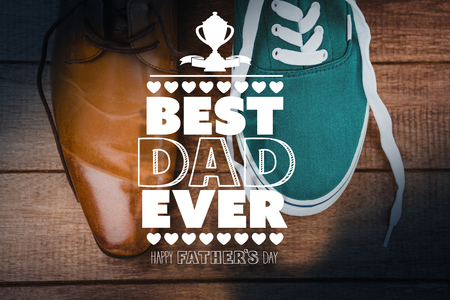 fathers day greeting against view of two different shoesの写真素材