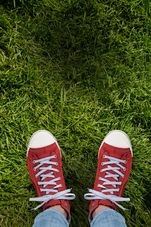 Casual shoes against grass backgroundの写真素材