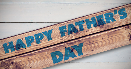 Happy fathers day against wooden planks backgroundの写真素材