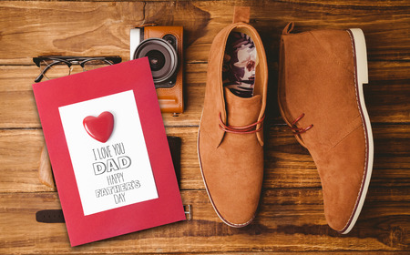 fathers day greeting against everyday usable vintage objects on wooden table