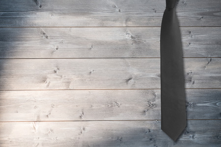 Blue tie against bleached wooden planks backgroundの写真素材