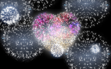 Digitally generated colourful fireworks exploding on black backgroundの写真素材