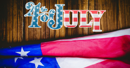 Independence day graphic against usa flag on tableの写真素材