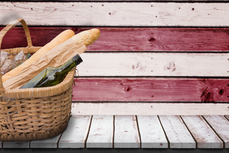 Picnic of wine and baguettes against composite image of usa national flagの写真素材