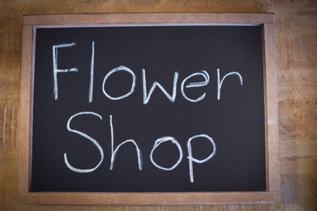 Close-up of slate with flower shop sign in the flower shopの写真素材