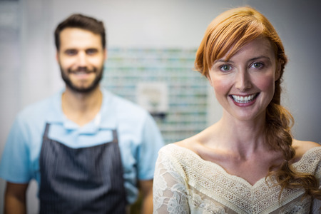 Portrait of couple smiling in the flower shopの写真素材