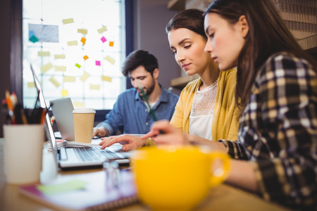 Business people working at desk in creative office