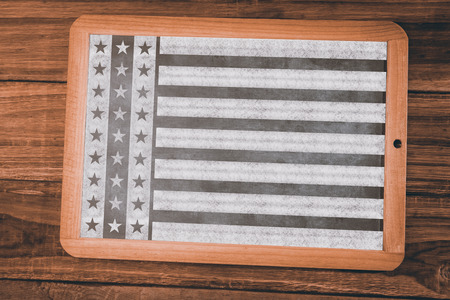 Focus on line  against chalkboard on deskの写真素材