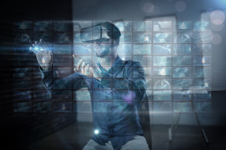Screen collage showing computing images against man using virtual glassの写真素材