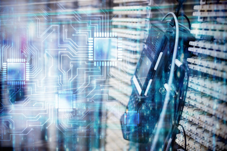 Digitally generated black and blue matrix against image of a technology deviceの写真素材