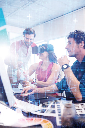 Blue and red technology interface against colleagues using technology
