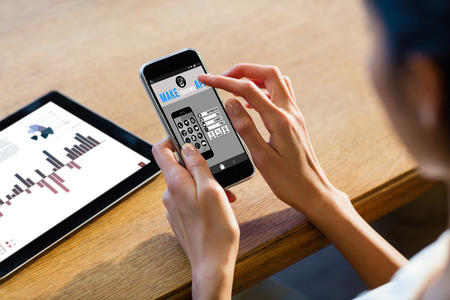 Make your own app smartphone against businesswoman using a smartphoneの写真素材