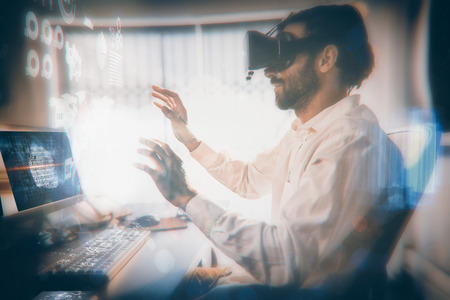 Futuristic technology interface against businessman wearing virtual glassesの写真素材