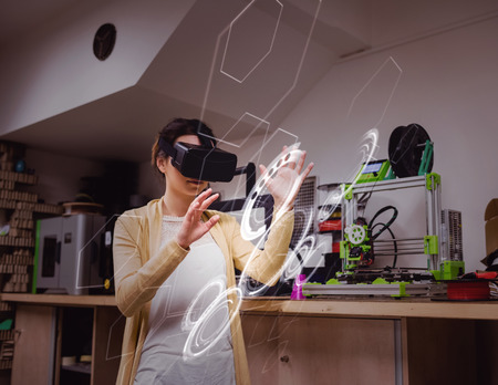 interface against female graphic designer using the virtual reality headset