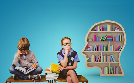 Pupils studying against blue vignette background
