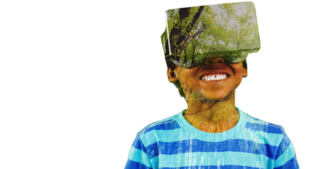 Boy using a virtual reality device against view of trees
