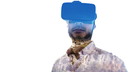 Portrait of businessman holding virtual glasses against view of beautiful landscapeの写真素材