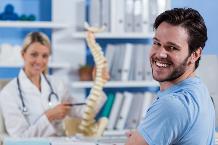 Portrait of physiotherapist and male patient in the clinicの写真素材