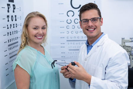 Portrait of female patient and optometrist in ophthalmology clinicの写真素材